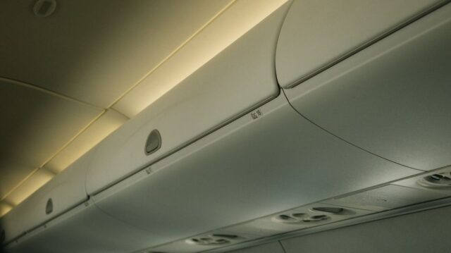 airplane cabin luggage overhead bin